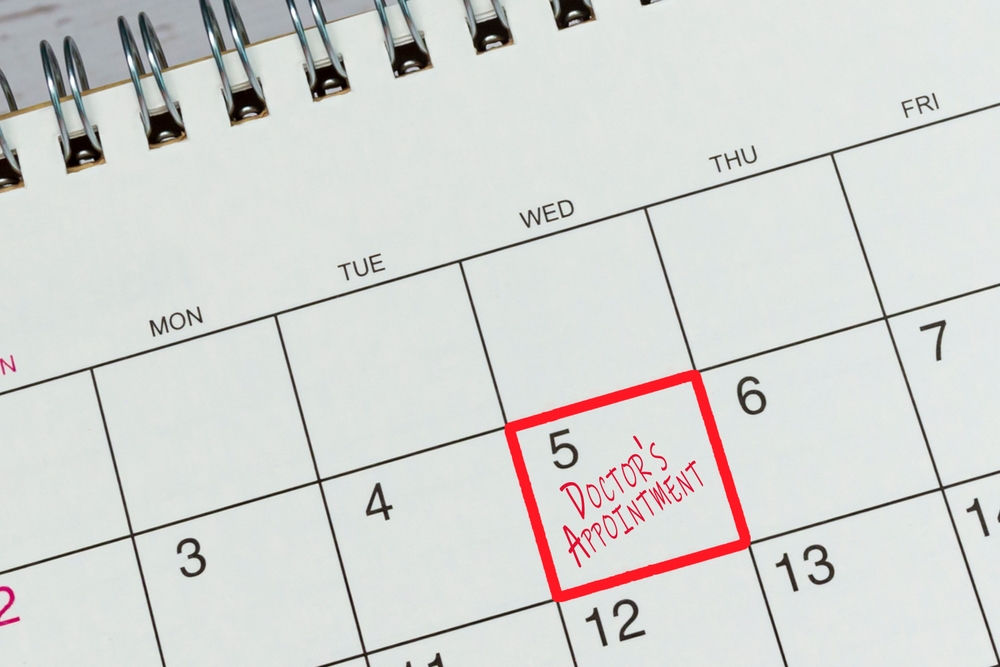 Red mark on the calendar at 5 for reminder of doctor's appointment. 