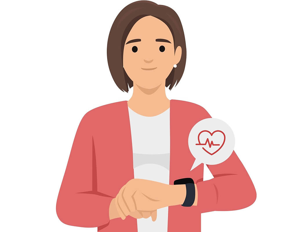 Young woman looks at smart watch with heart rate.