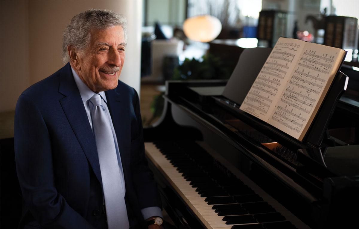 Tony Bennett sitting at piano